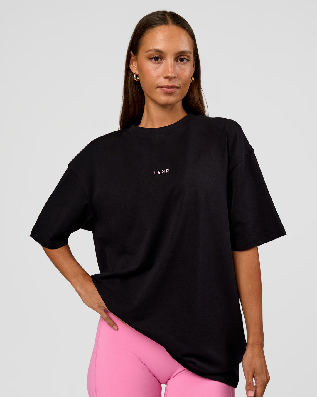 Woman wearing CFT BNE 26 FLXCotton Oversized Tee in Black | Model:Brylee | Size:XS