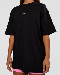 Woman wearing CFT BNE 26 FLXCotton Oversized Tee in Black | Model:Brylee | Size:XS