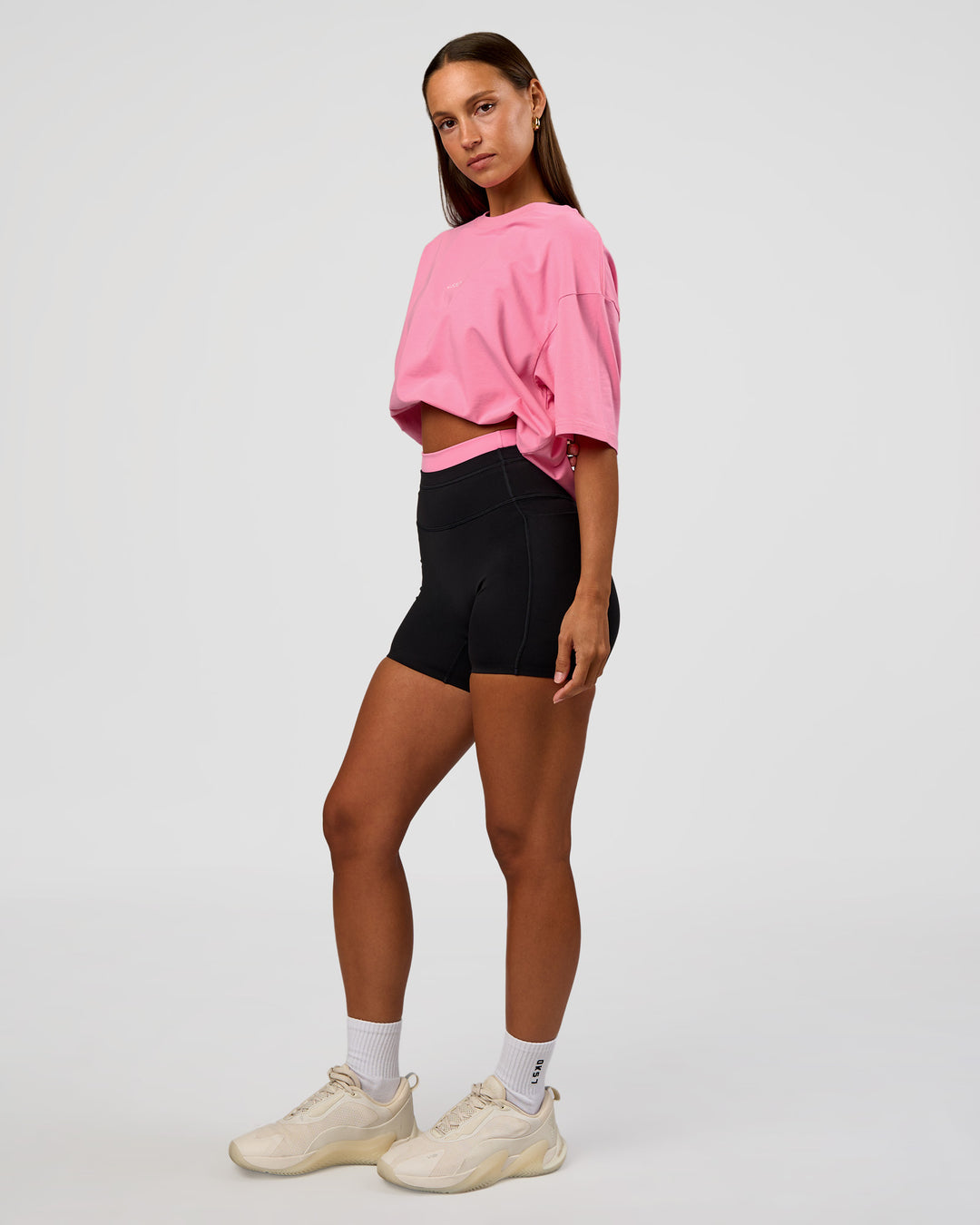 Woman wearing CFT BNE 26 FLXCotton Oversized Tee in Candy Pink | Model:Brylee | Size:XS
