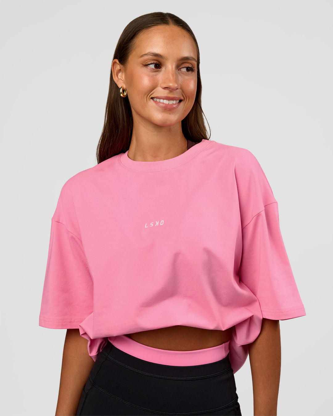 Woman wearing CFT BNE 26 FLXCotton Oversized Tee in Candy Pink | Model:Brylee | Size:XS