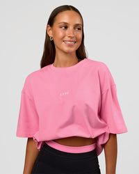 Woman wearing CFT BNE 26 FLXCotton Oversized Tee in Candy Pink | Model:Brylee | Size:XS