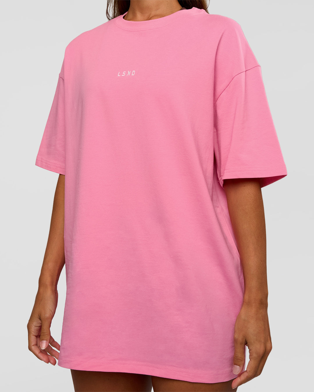 Woman wearing CFT BNE 26 FLXCotton Oversized Tee in Candy Pink | Model:Brylee | Size:XS
