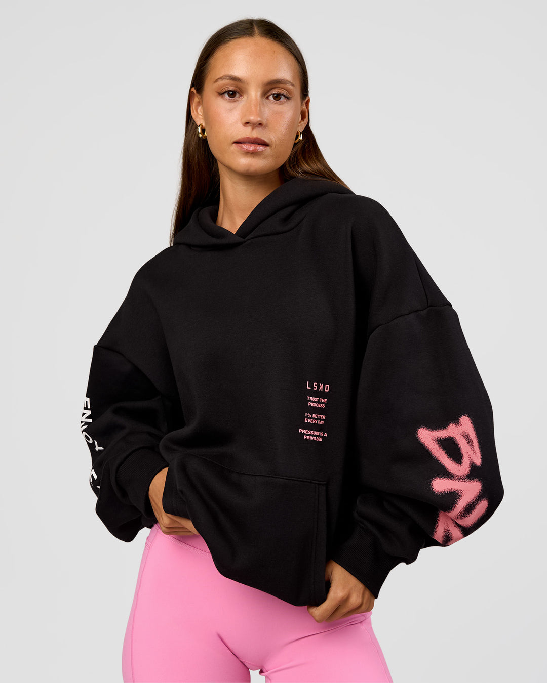 Woman wearing CFT BNE 26 Unisex Oversized Hoodie - Black-Candy Pink | Model:Brylee | Size:XS - view 7