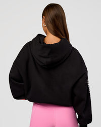 Woman wearing CFT BNE 26 Unisex Oversized Hoodie - Black-Candy Pink | Model:Brylee | Size:XS | Thumbnail Index: 1