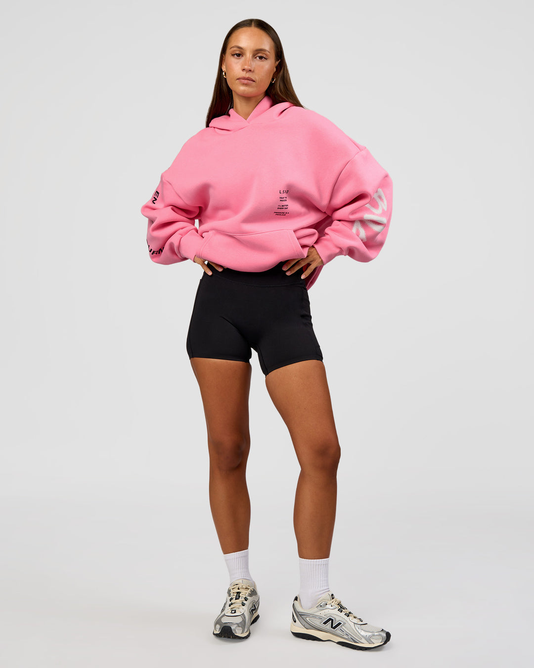 Woman wearing CFT BNE 26 Unisex Oversized Hoodie - Candy Pink-Black | Model:Brylee | Size:XS - view 4