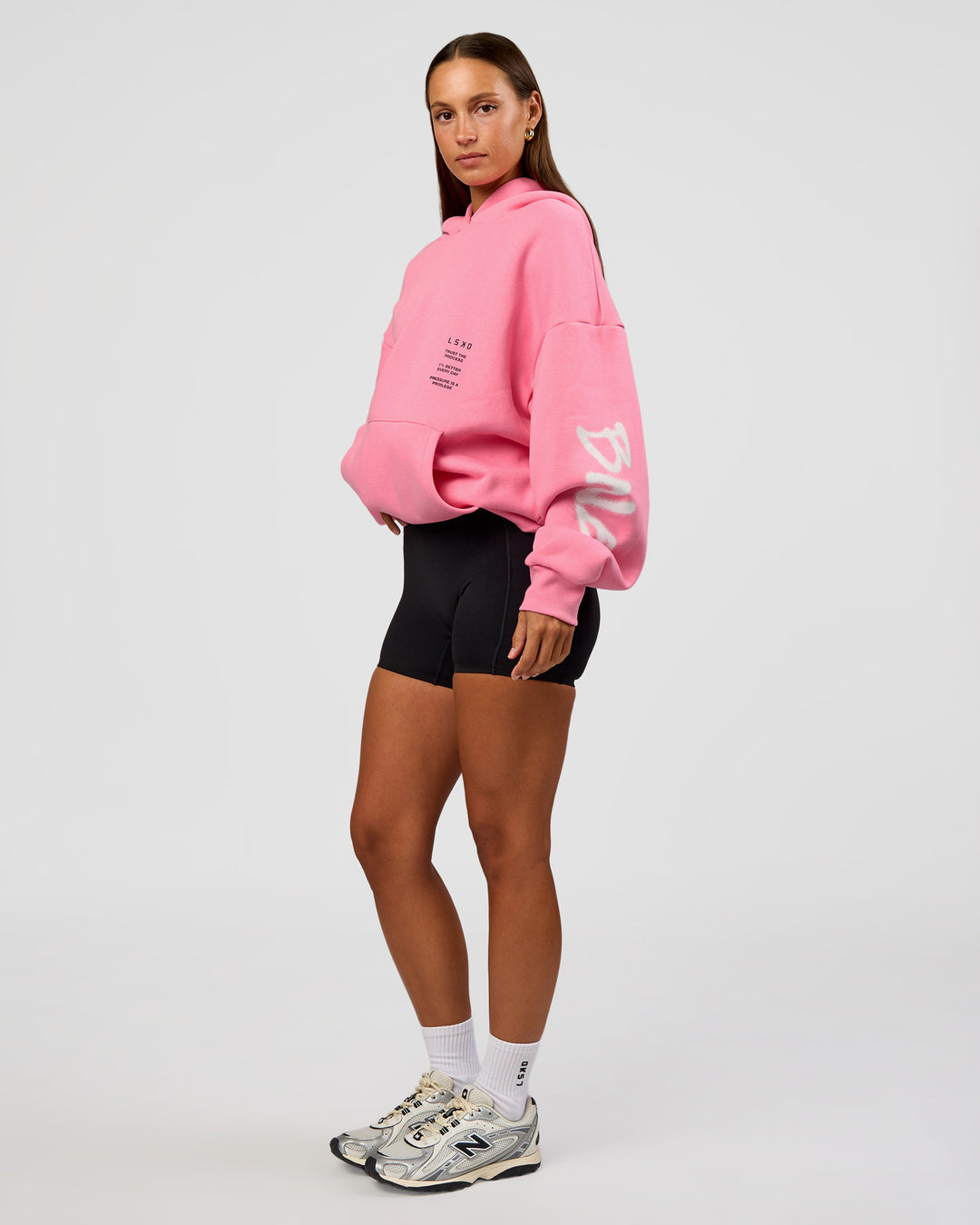 Woman wearing CFT BNE 26 Unisex Oversized Hoodie - Candy Pink-Black | Model:Brylee | Size:XS - view 9