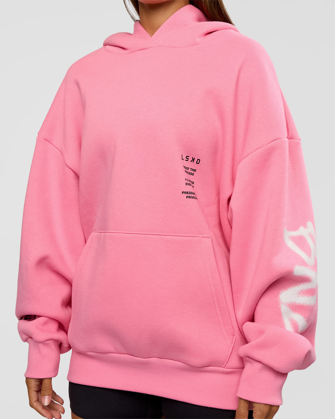 Woman wearing CFT BNE 26 Unisex Oversized Hoodie - Candy Pink-Black | Model:Brylee | Size:XS - view 12