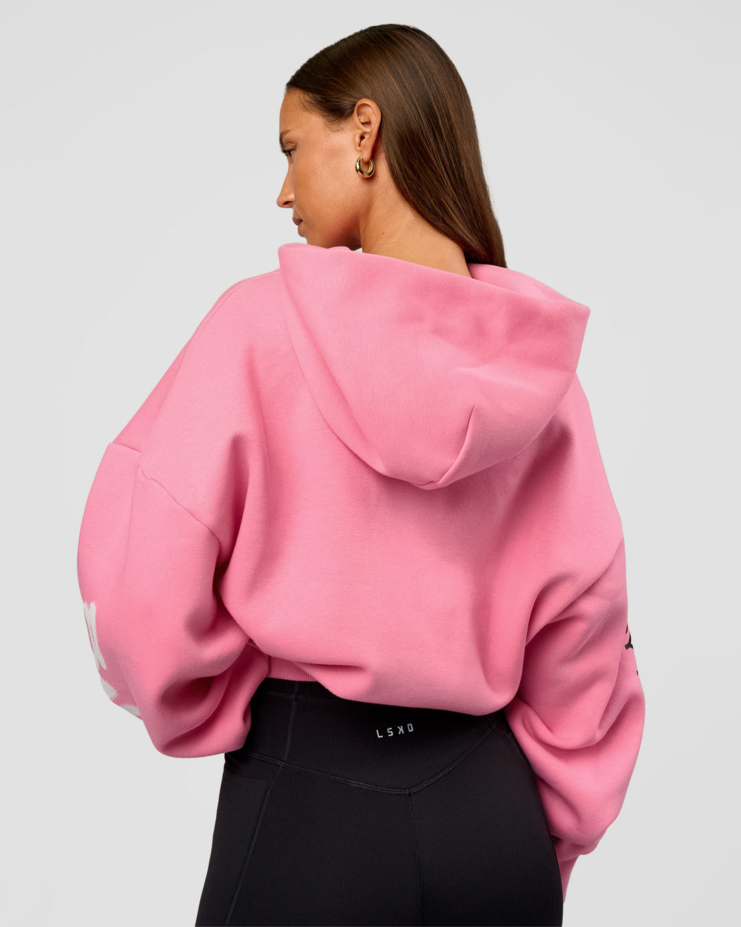 Woman wearing CFT BNE 26 Unisex Oversized Hoodie - Candy Pink-Black | Model:Brylee | Size:XS - view 13