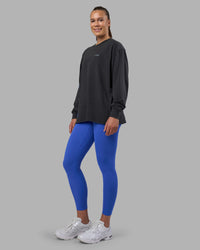 Woman wearing Cali FLXCotton Oversized Long Sleeve Tee - Black Washed | Model:Charlize | Size:XS