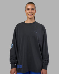 Woman wearing Cali FLXCotton Oversized Long Sleeve Tee - Black Washed | Model:Charlize | Size:XS