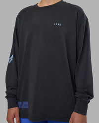 Woman wearing Cali FLXCotton Oversized Long Sleeve Tee - Black Washed | Model:Charlize | Size:XS