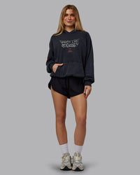 Woman wearing Chrome Washed Oversized Hoodie - Black | Model:Emilie | Size:XS