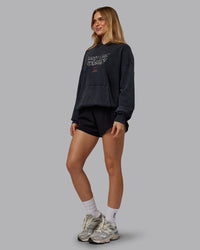 Woman wearing Chrome Washed Oversized Hoodie - Black | Model:Emilie | Size:XS