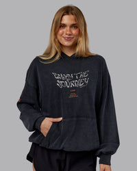 Woman wearing Chrome Washed Oversized Hoodie - Black | Model:Emilie | Size:XS