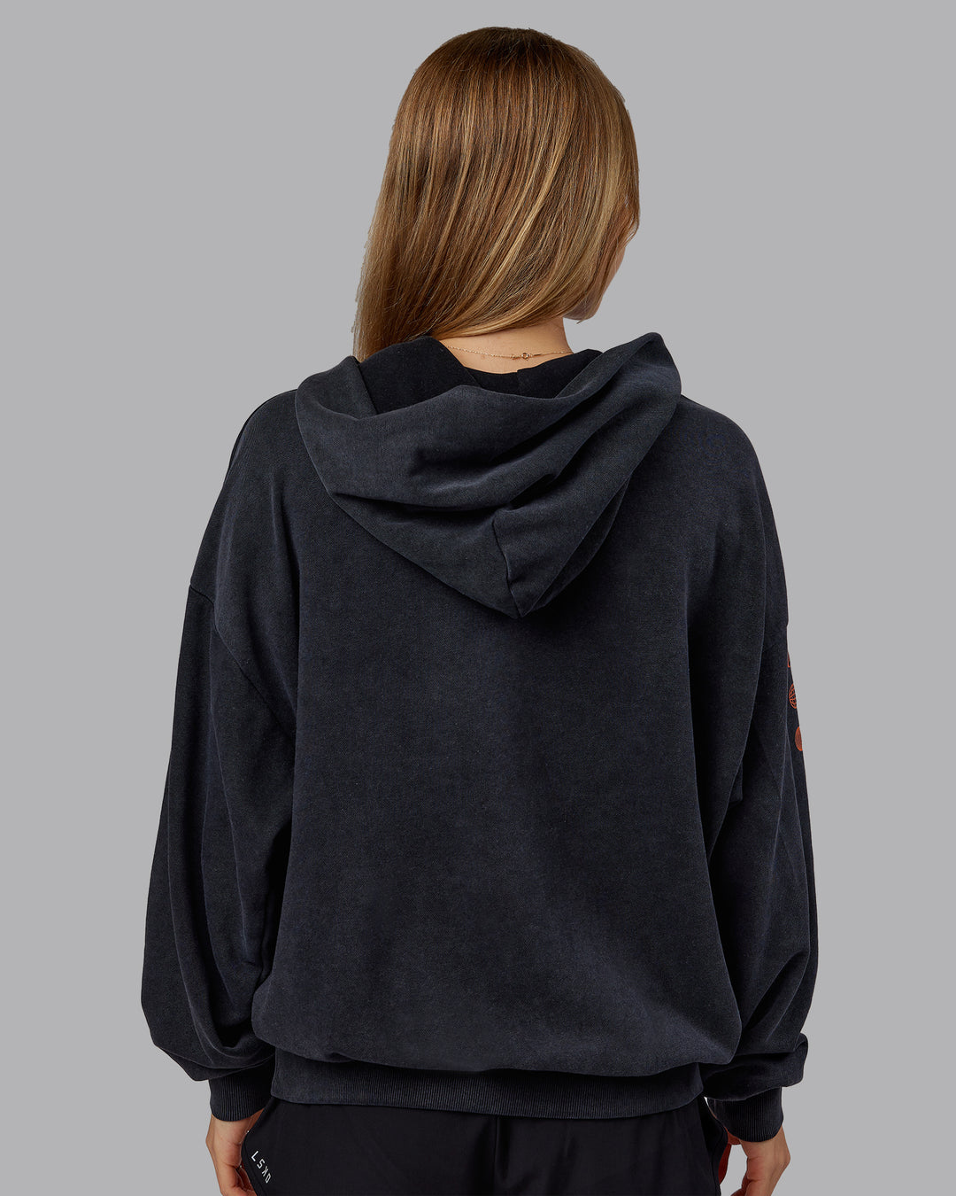 Woman wearing Chrome Washed Oversized Hoodie - Black | Model:Emilie | Size:XS