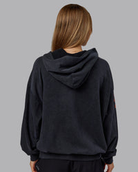 Woman wearing Chrome Washed Oversized Hoodie - Black | Model:Emilie | Size:XS