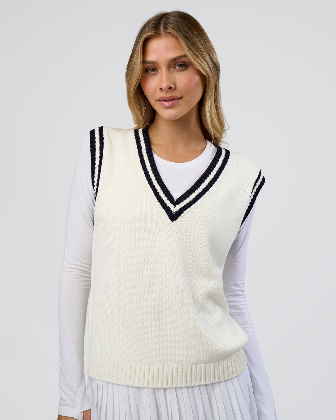 Woman wearing Clubhouse Vest - Off White-Future Navy | Model:Leilani | Size:XS