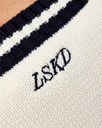 Woman wearing Clubhouse Vest - Off White-Future Navy | Model:Leilani | Size:XS