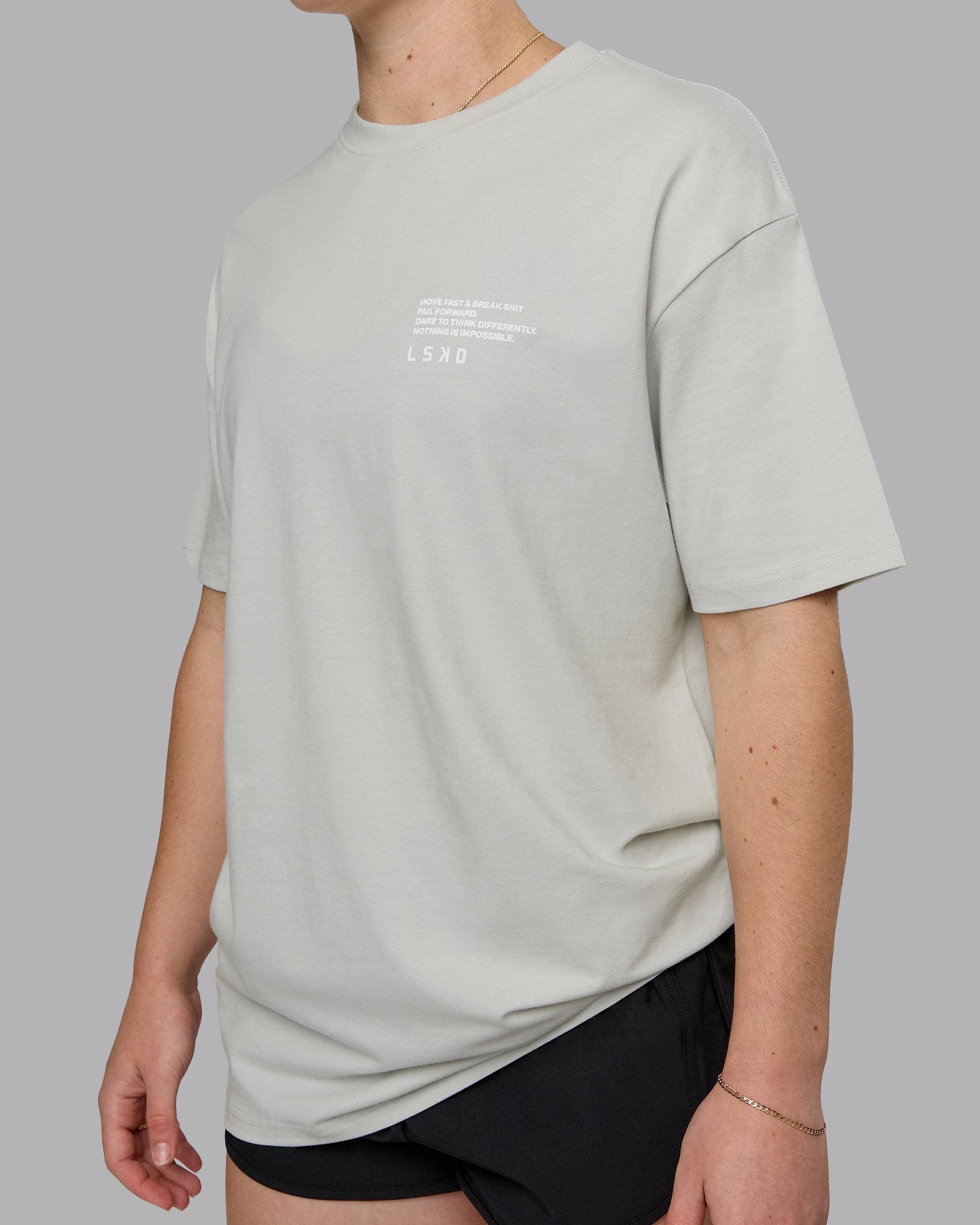 Woman wearing Coffee Run FLXCotton Oversized Tee - Digital Mist-Scarlet | Model:Sav | Size:XS