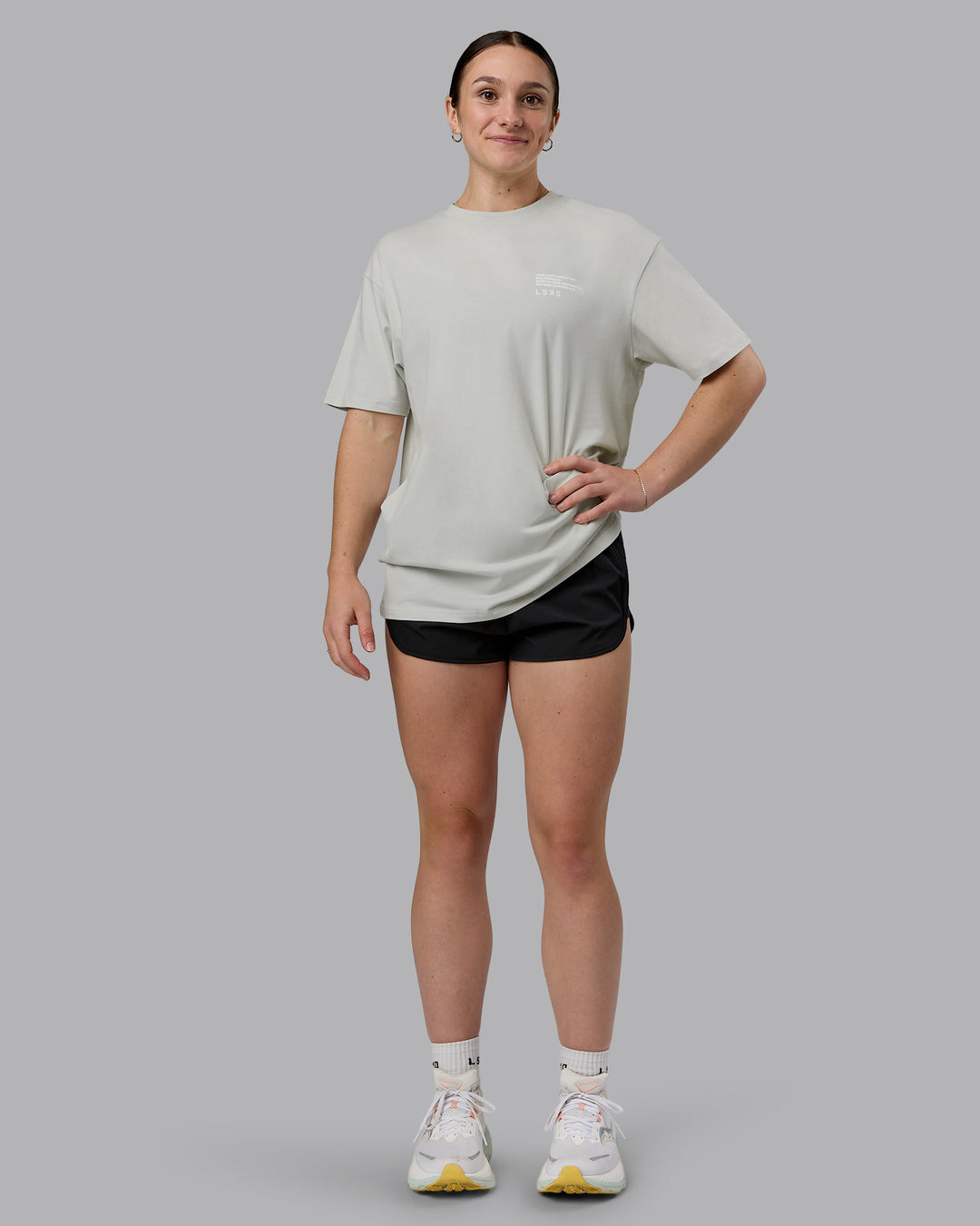 Woman wearing Coffee Run FLXCotton Oversized Tee - Digital Mist-Scarlet | Model:Sav | Size:XS