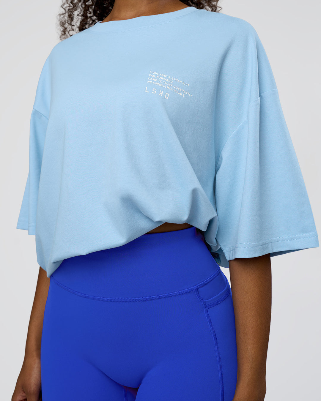 Woman wearing Coffee Run FLXCotton Oversized Tee - Open Air-White | Model:Jordan | Size:L