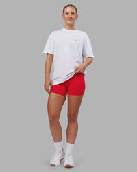 Woman wearing Dare To Think FLXCotton Tee Oversize - White-Scarlet | Model:Neve | Size:XS