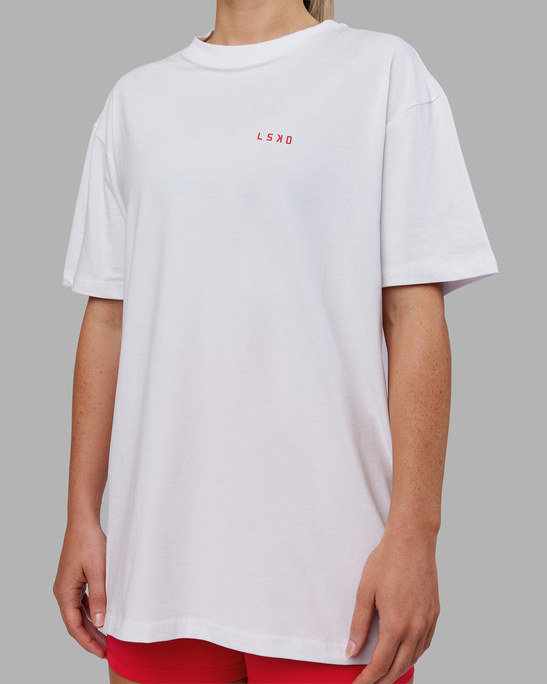 Woman wearing Dare To Think FLXCotton Tee Oversize - White-Scarlet | Model:Neve | Size:XS