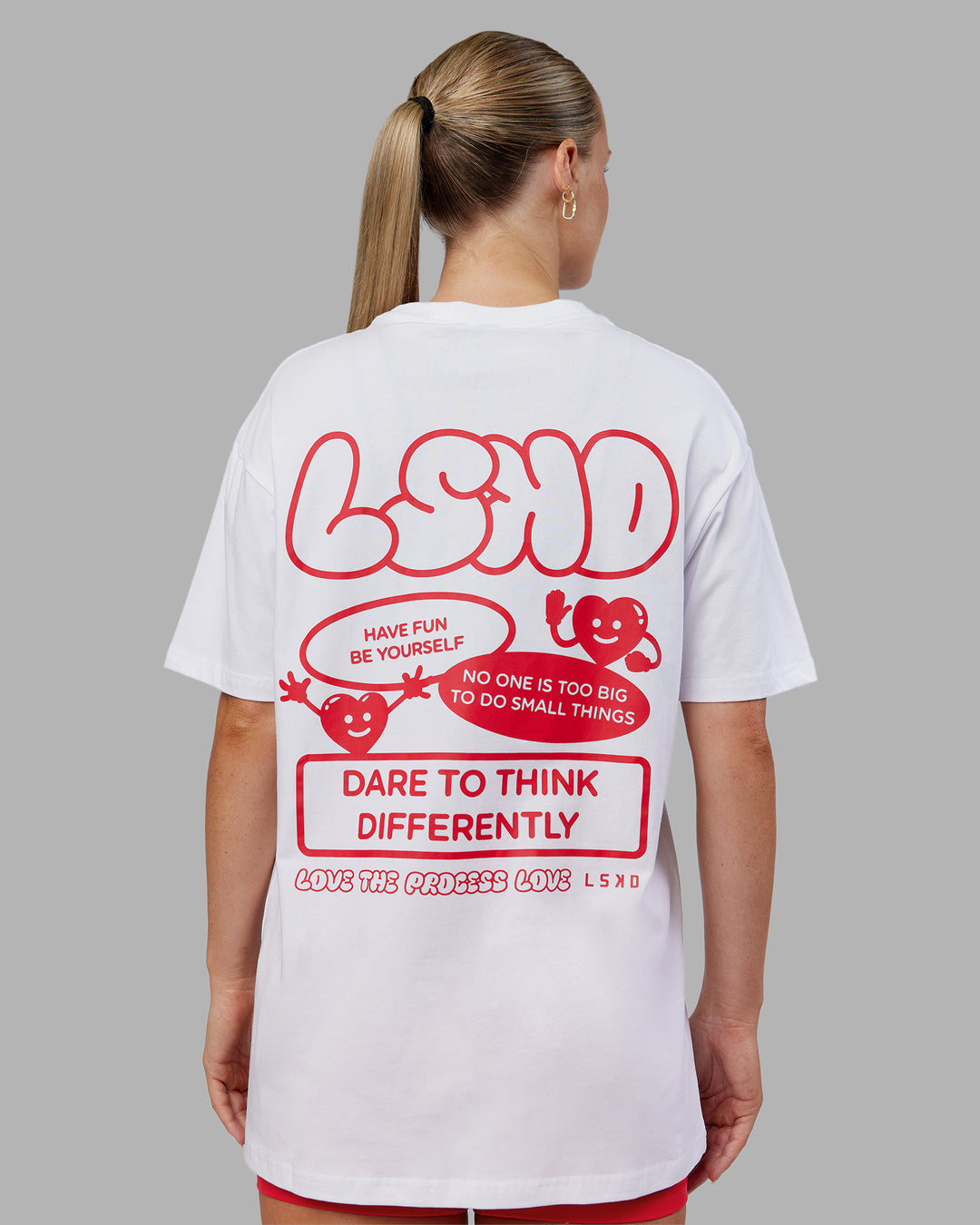 Woman wearing Dare To Think FLXCotton Tee Oversize - White-Scarlet | Model:Neve | Size:XS