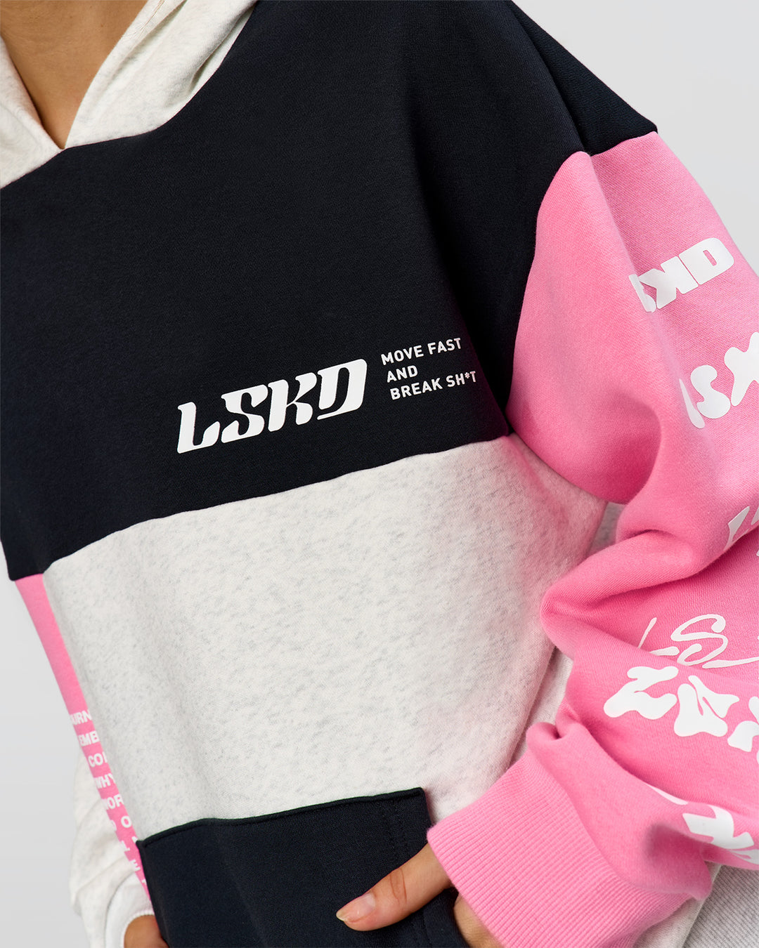 Woman wearing Deconstructed Fleece Hoodie - Caviar-Candy Pink-Grey Marl | Model:Leilani | Size:XS