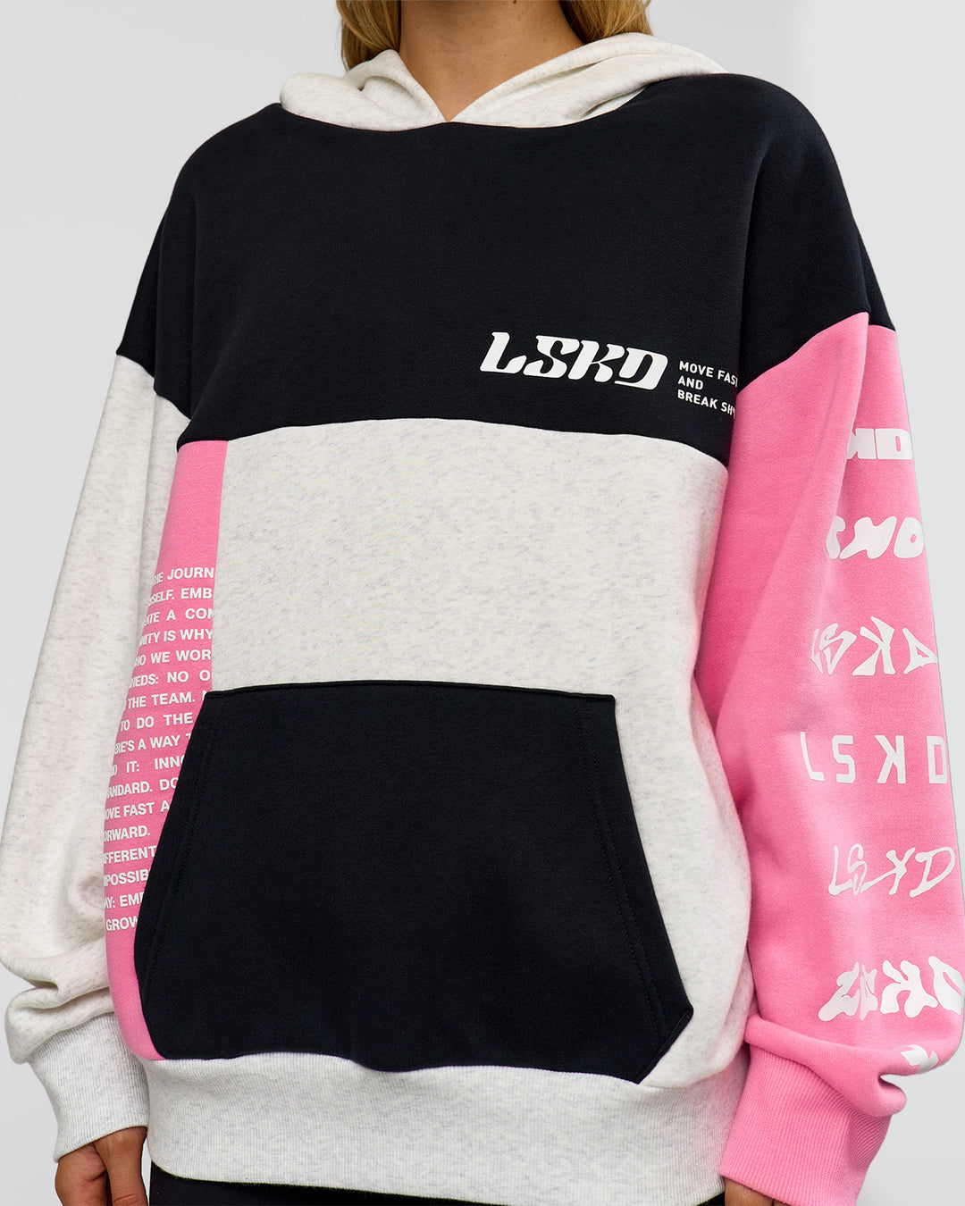 Woman wearing Deconstructed Fleece Hoodie - Caviar-Candy Pink-Grey Marl | Model:Leilani | Size:XS