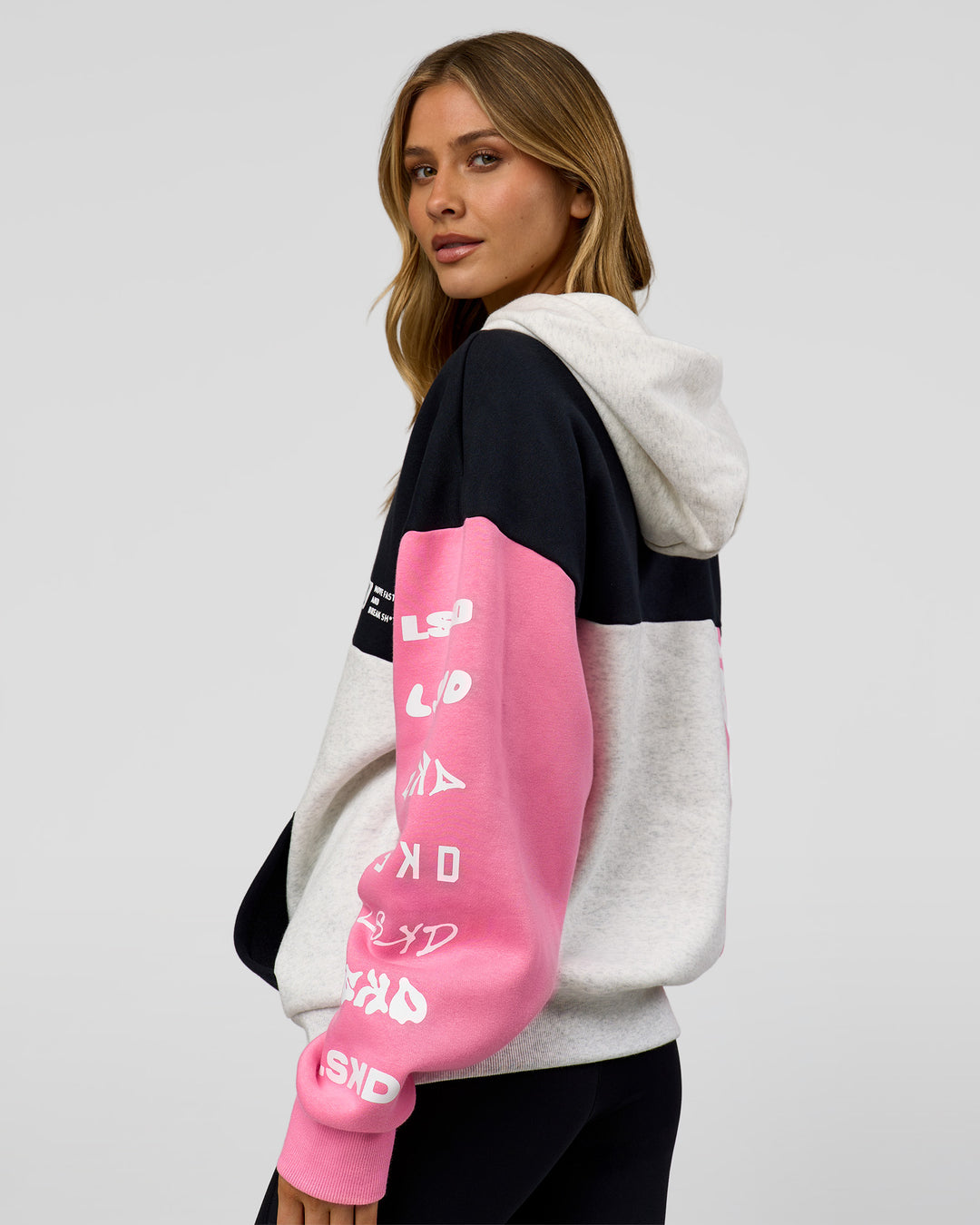 Woman wearing Deconstructed Fleece Hoodie - Caviar-Candy Pink-Grey Marl | Model:Leilani | Size:XS