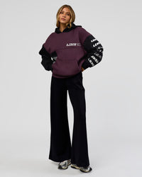 Woman wearing Deconstructed Fleece Hoodie - Caviar-Midnight Plum | Model:Leilani | Size:XS