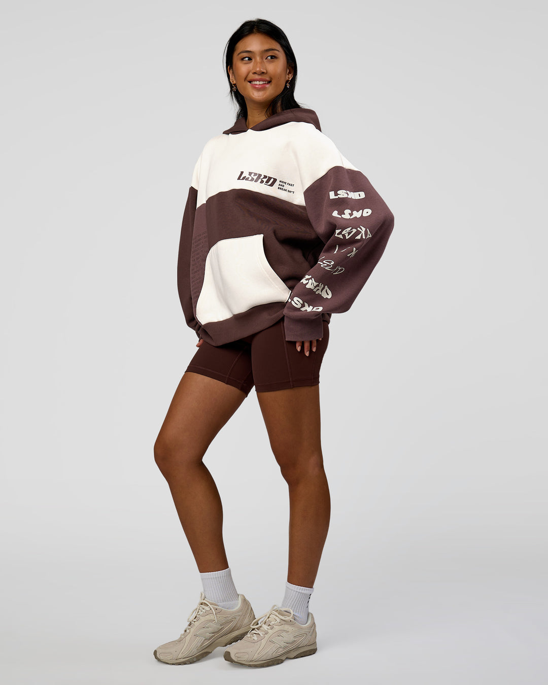 Woman wearing Deconstructed Fleece Hoodie - Off White-Cocoa Powder-Choc | Model:Loren | Size:XS