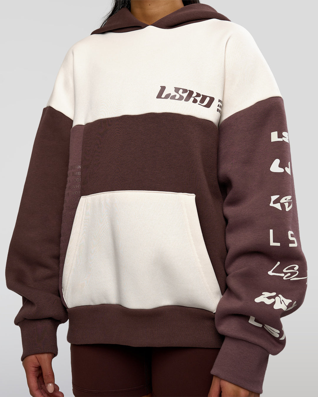 Woman wearing Deconstructed Fleece Hoodie - Off White-Cocoa Powder-Choc | Model:Loren | Size:XS
