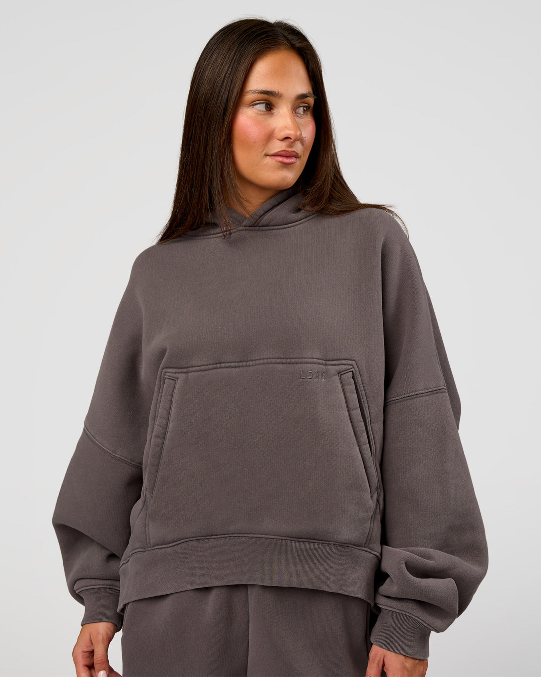 Woman wearing Distort Oversized Hoodie - Duskstone Washed | Model:Bianca | Size:XS