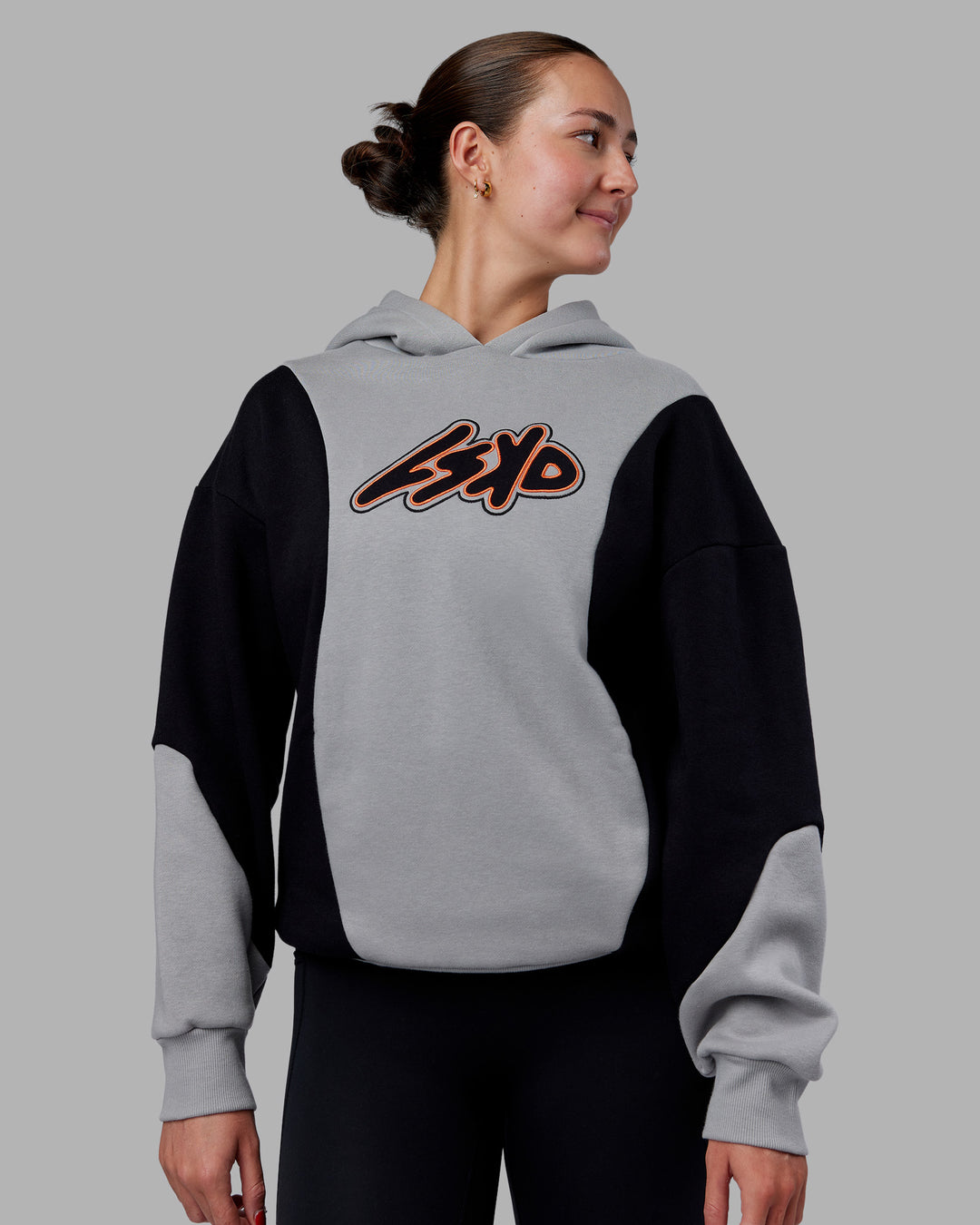 Woman wearing Downtown Oversized Panel Hoodie - Circular Grey - Black | Model:Remmi | Size:XS