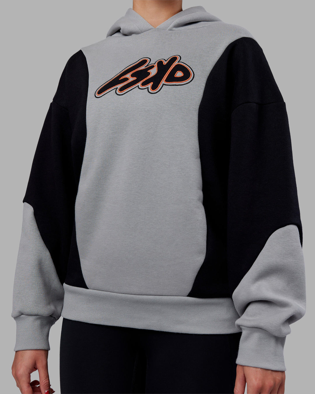 Woman wearing Downtown Oversized Panel Hoodie - Circular Grey - Black | Model:Remmi | Size:XS