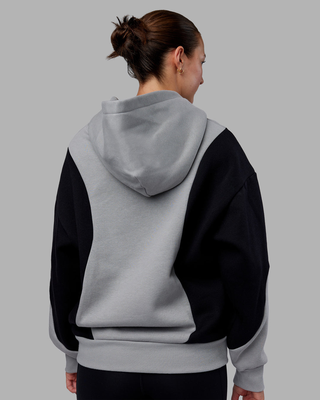 Woman wearing Downtown Oversized Panel Hoodie - Circular Grey - Black | Model:Remmi | Size:XS