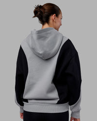 Woman wearing Downtown Oversized Panel Hoodie - Circular Grey - Black | Model:Remmi | Size:XS