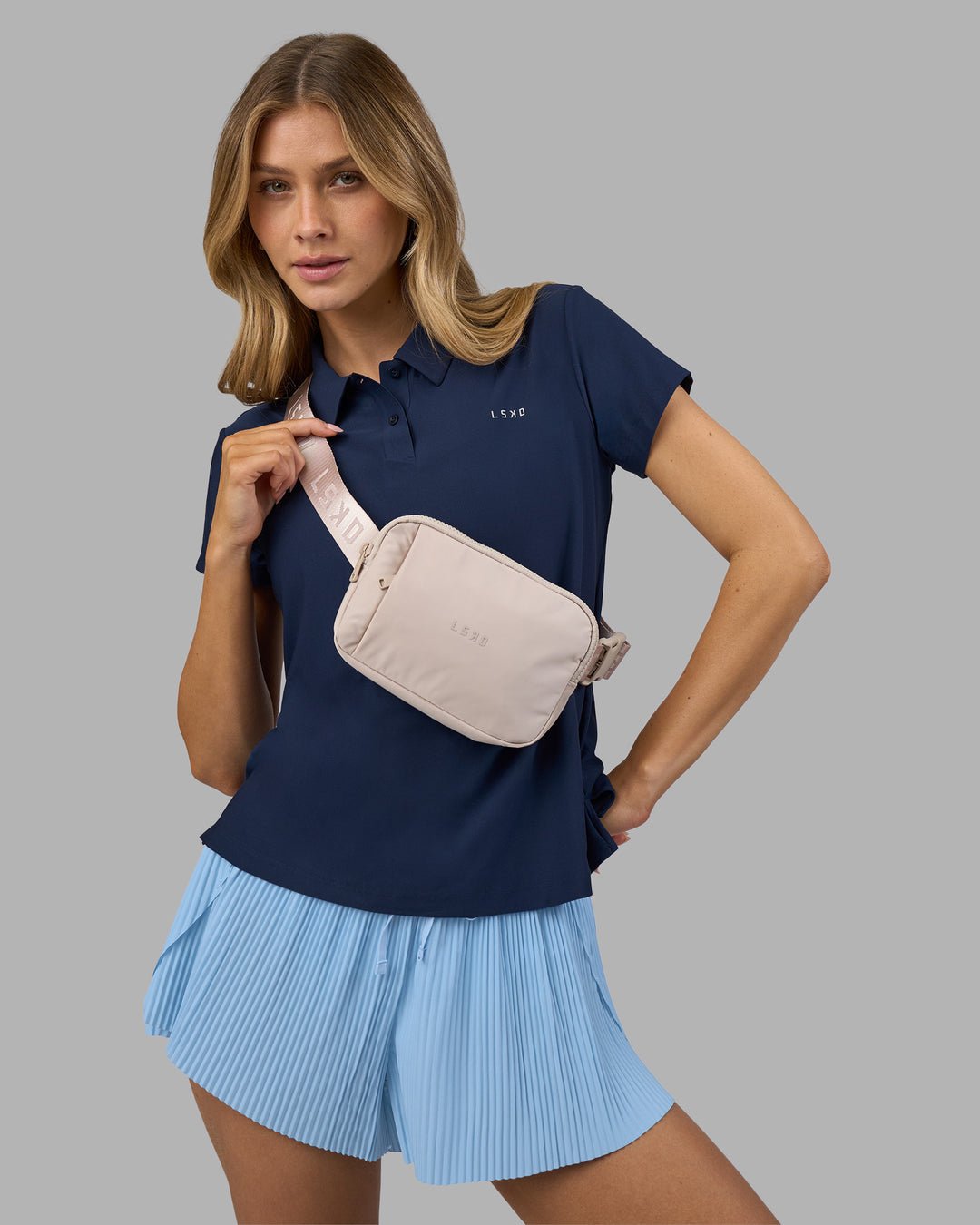 Woman wearing Drive Polo - Future Navy | Model:Leilani | Size:XS