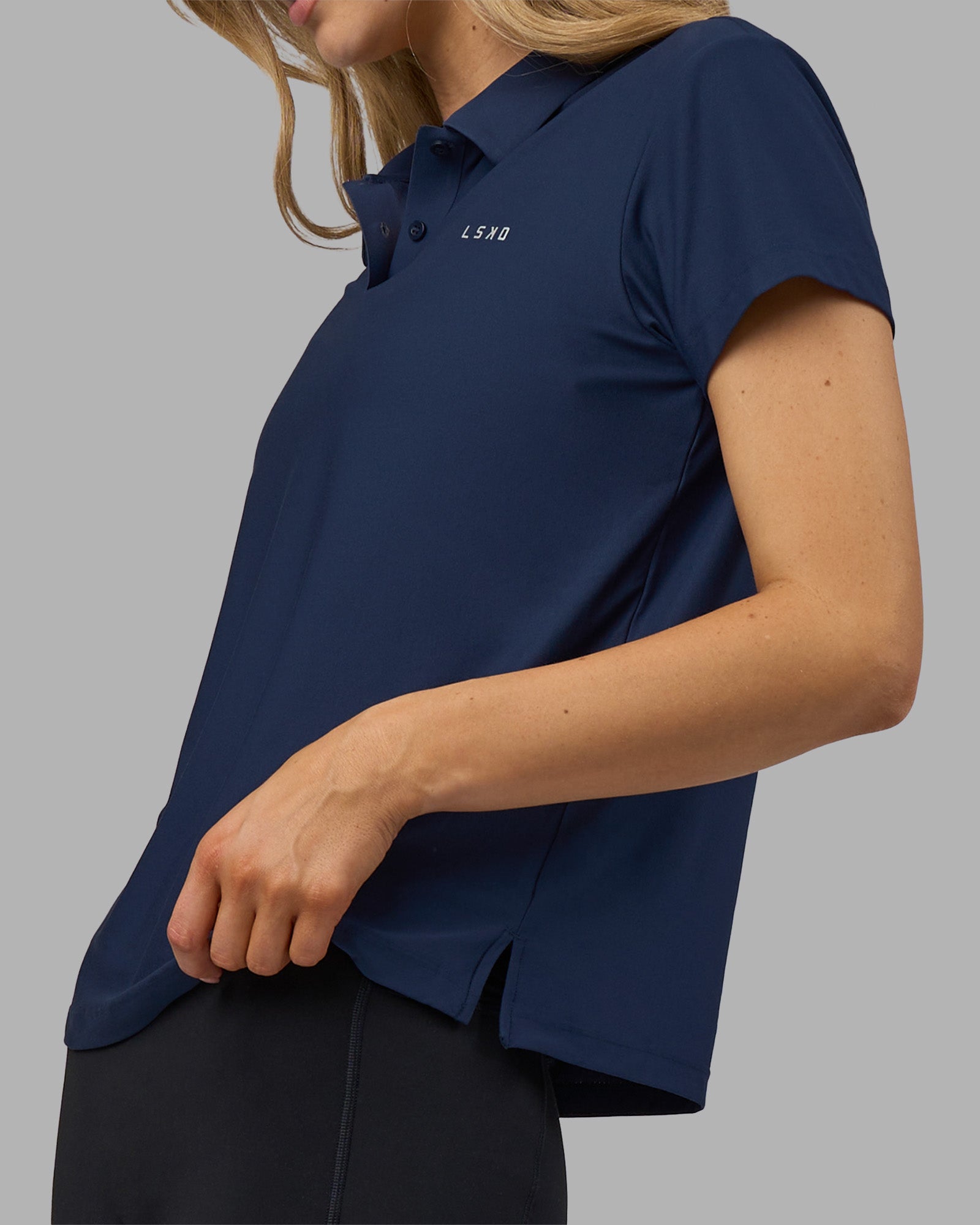 Woman wearing Drive Polo - Future Navy | Model:Leilani | Size:XS