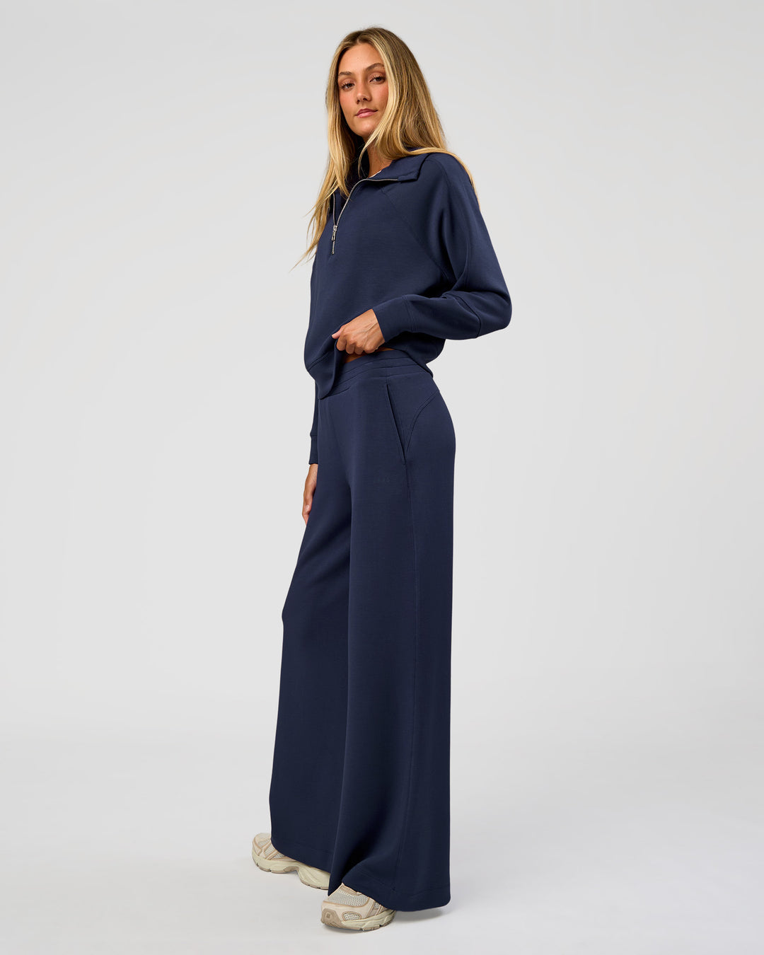 Woman wearing Elevate SoftTouch 1/2 Zip Sweater - Future Navy | Model:Georgia | Size:XS