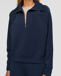 Woman wearing Elevate SoftTouch 1/2 Zip Sweater - Future Navy | Model:Georgia | Size:XS