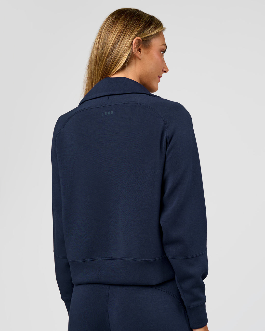 Woman wearing Elevate SoftTouch 1/2 Zip Sweater - Future Navy | Model:Georgia | Size:XS