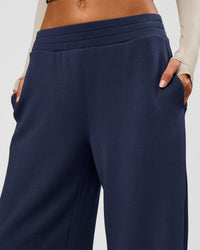 Woman wearing Elevate SoftTouch Wide Leg Pant - Future Navy | Model:Georgia | Size:XS
