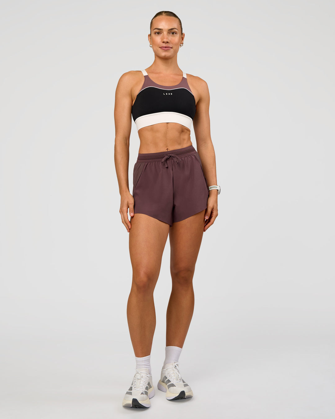Woman wearing Elevated Accelerate Sports Bra - Black-Multi | Model:Maja | Size:XS