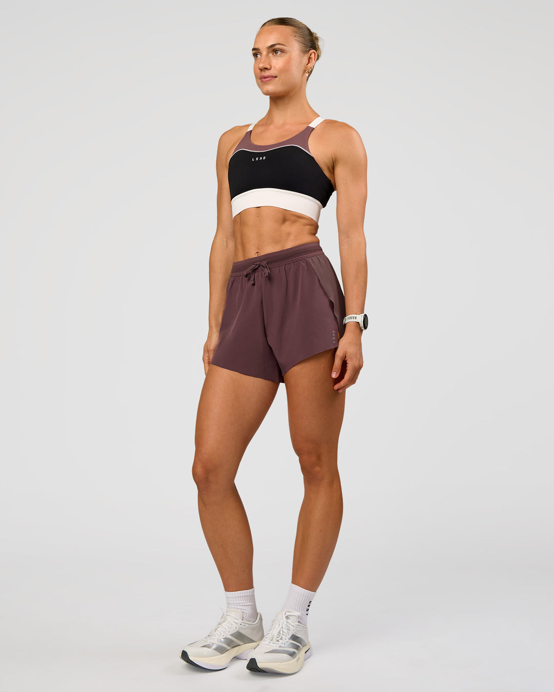 Woman wearing Elevated Accelerate Sports Bra - Black-Multi | Model:Maja | Size:XS