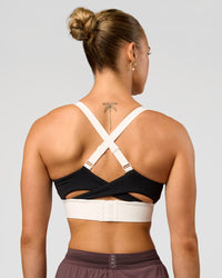 Woman wearing Elevated Accelerate Sports Bra - Black-Multi | Model:Maja | Size:XS