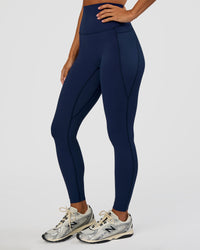 Woman wearing Elixir Ultra High-Rise Full Length Legging Pockets - Future Navy | Model:Brylee | Size:XS