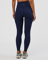 Woman wearing Elixir Ultra High-Rise Full Length Legging Pockets - Future Navy | Model:Brylee | Size:XS